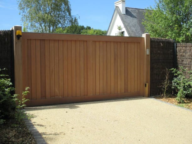 Sliding wooden drive gate